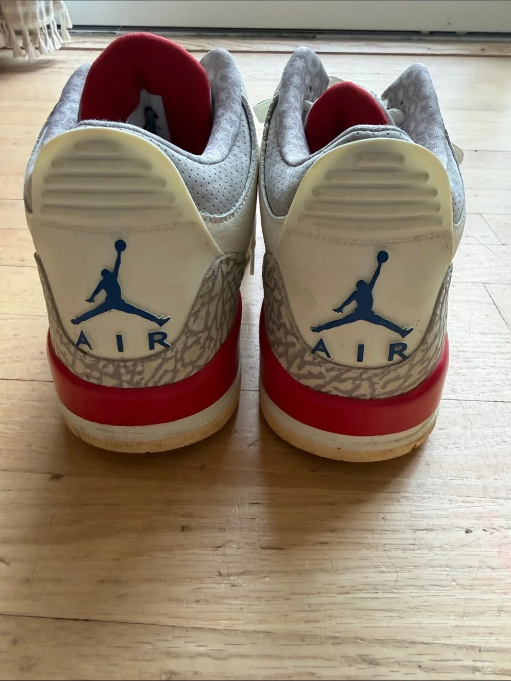 Nike White Sneakers with Blue & Red Accents